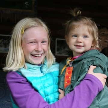 a little girl posing for a picture