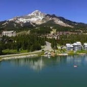 a body of water with a mountain in the background