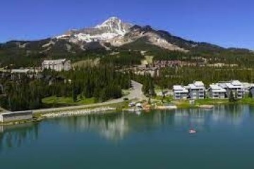 a body of water with a mountain in the background